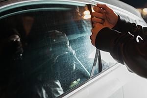 a man stealing a car